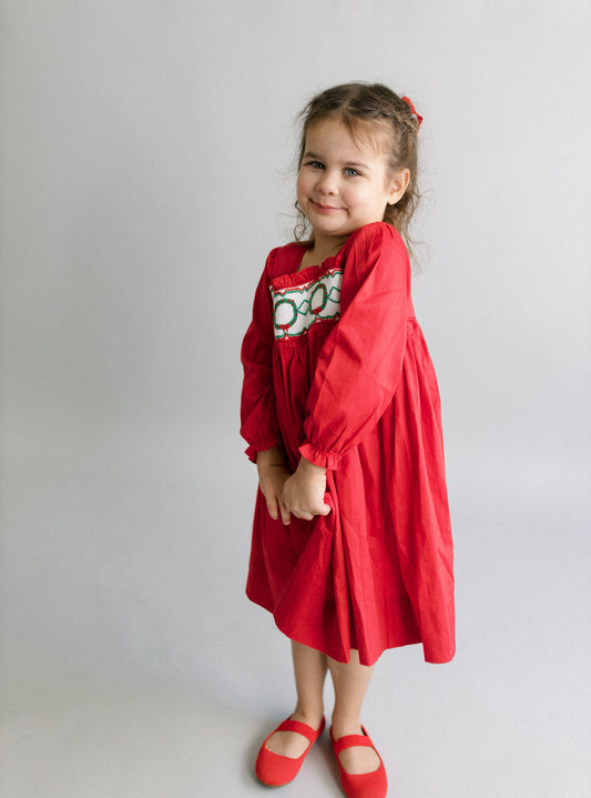Red hand smocked wreath dress