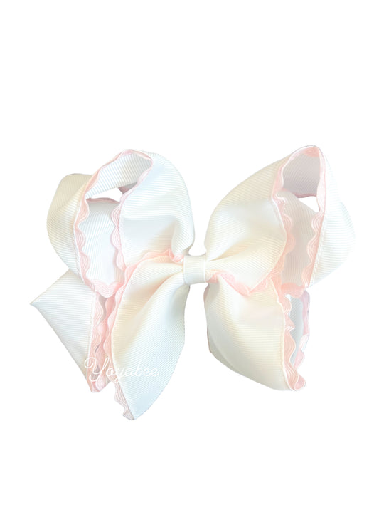 White bow with pink ric rac