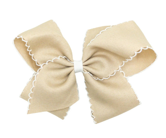 Tan bow white moonstitch