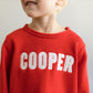 Red roll neck sweater